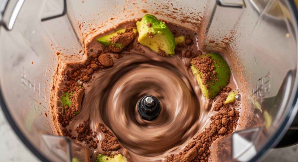 Blender with chocolate mousse ingredients.