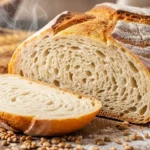 Thumbnail of sliced bread with airy texture on wood.