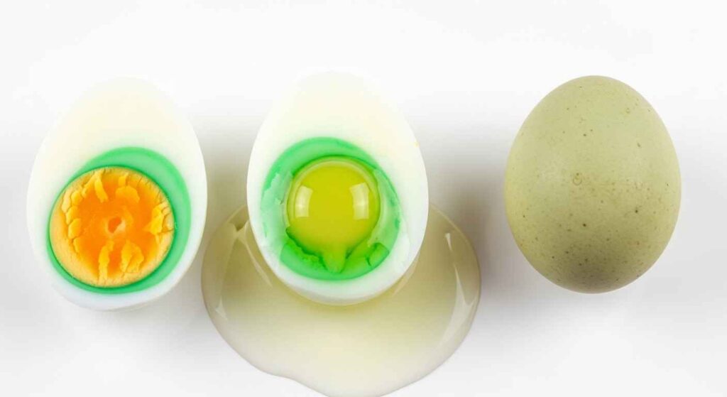 Three types of green eggs showing overcooked ring, natural white coloration, and green shell varieties